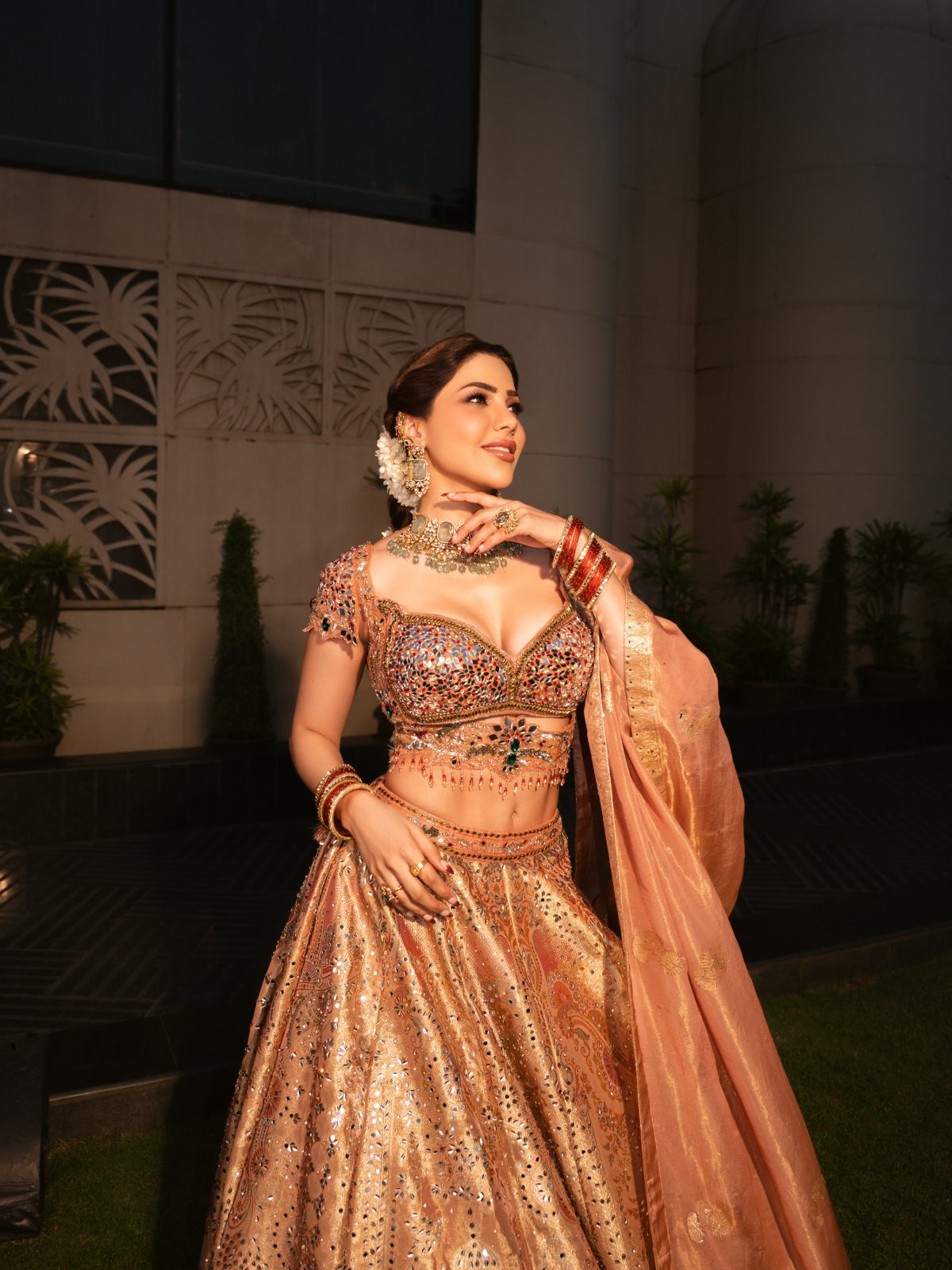 Peach Lehenga Paired With Green Stone Jewellery