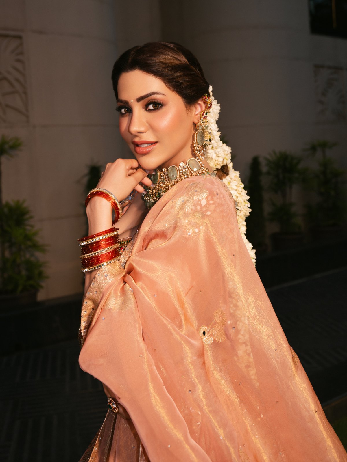 Peach Lehenga Paired With Green Stone Jewellery