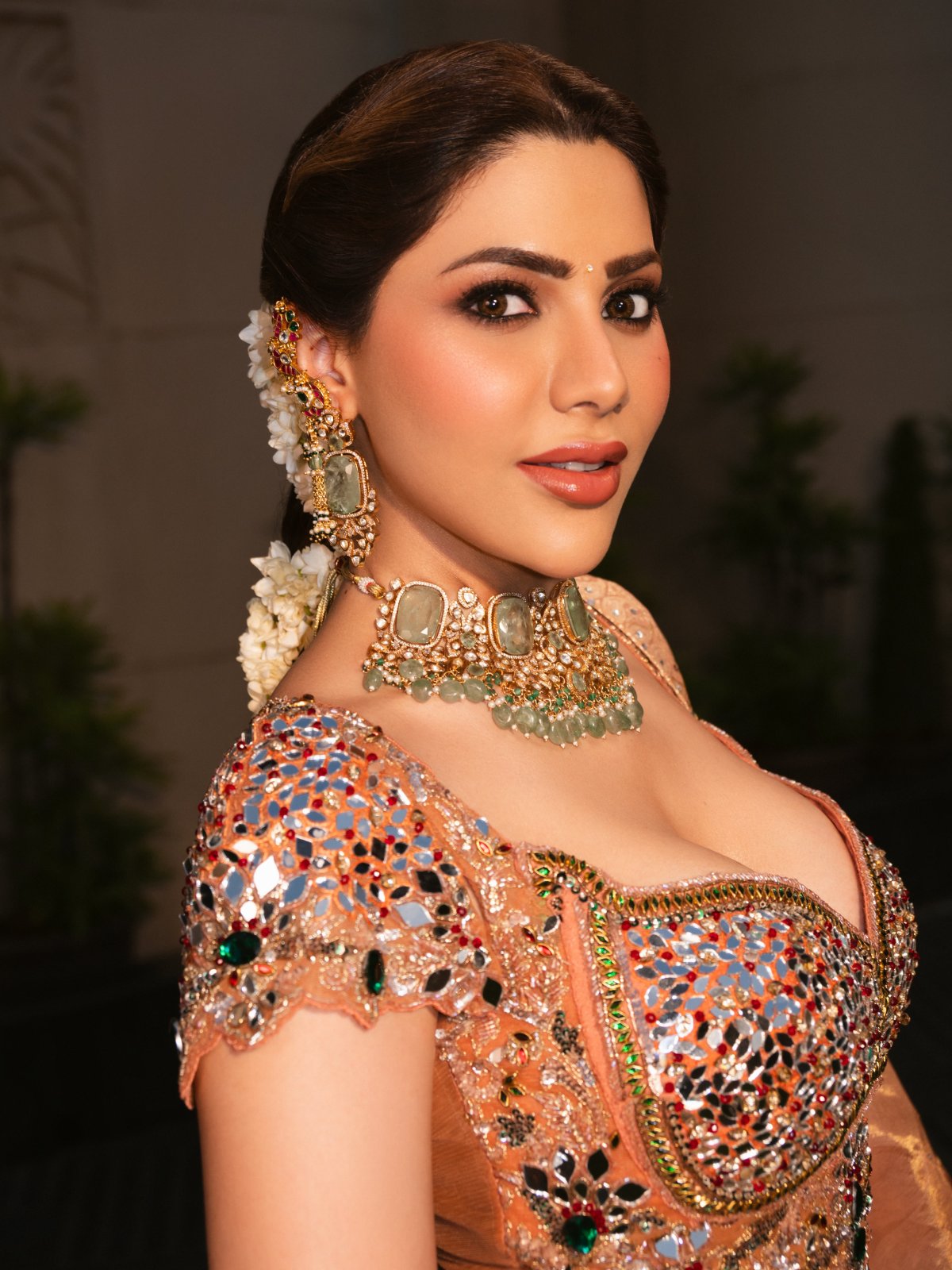Peach Lehenga Paired With Green Stone Jewellery