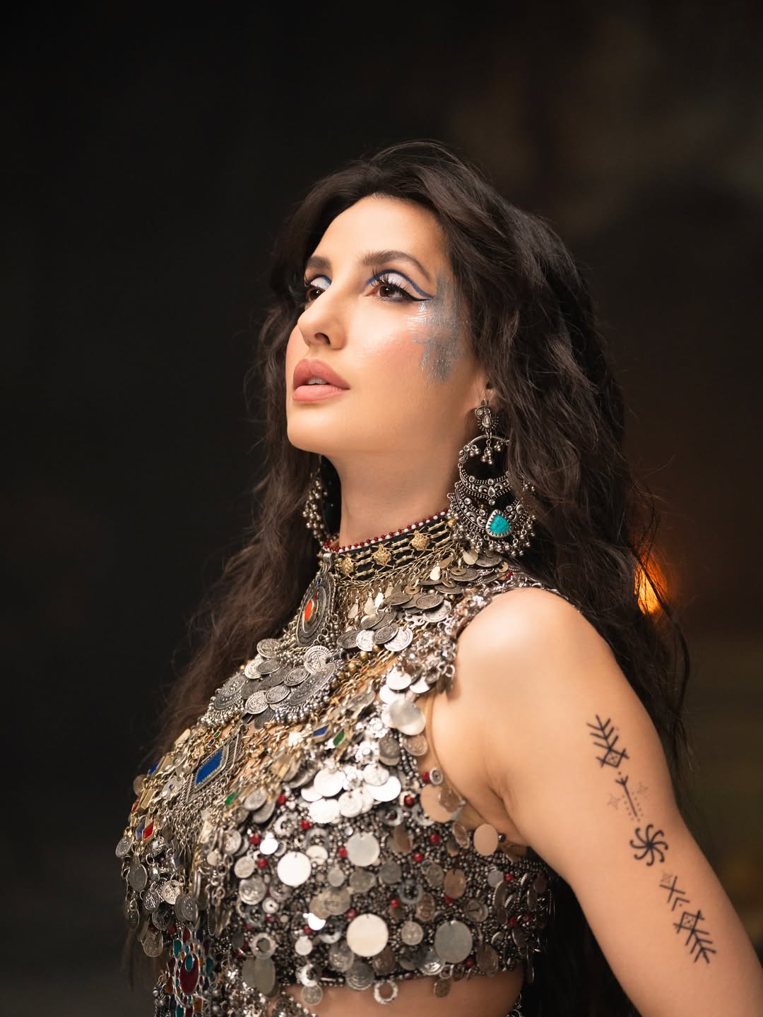 Nora Fatehi's Dazzling Metallic Glamour: A Photo Gallery