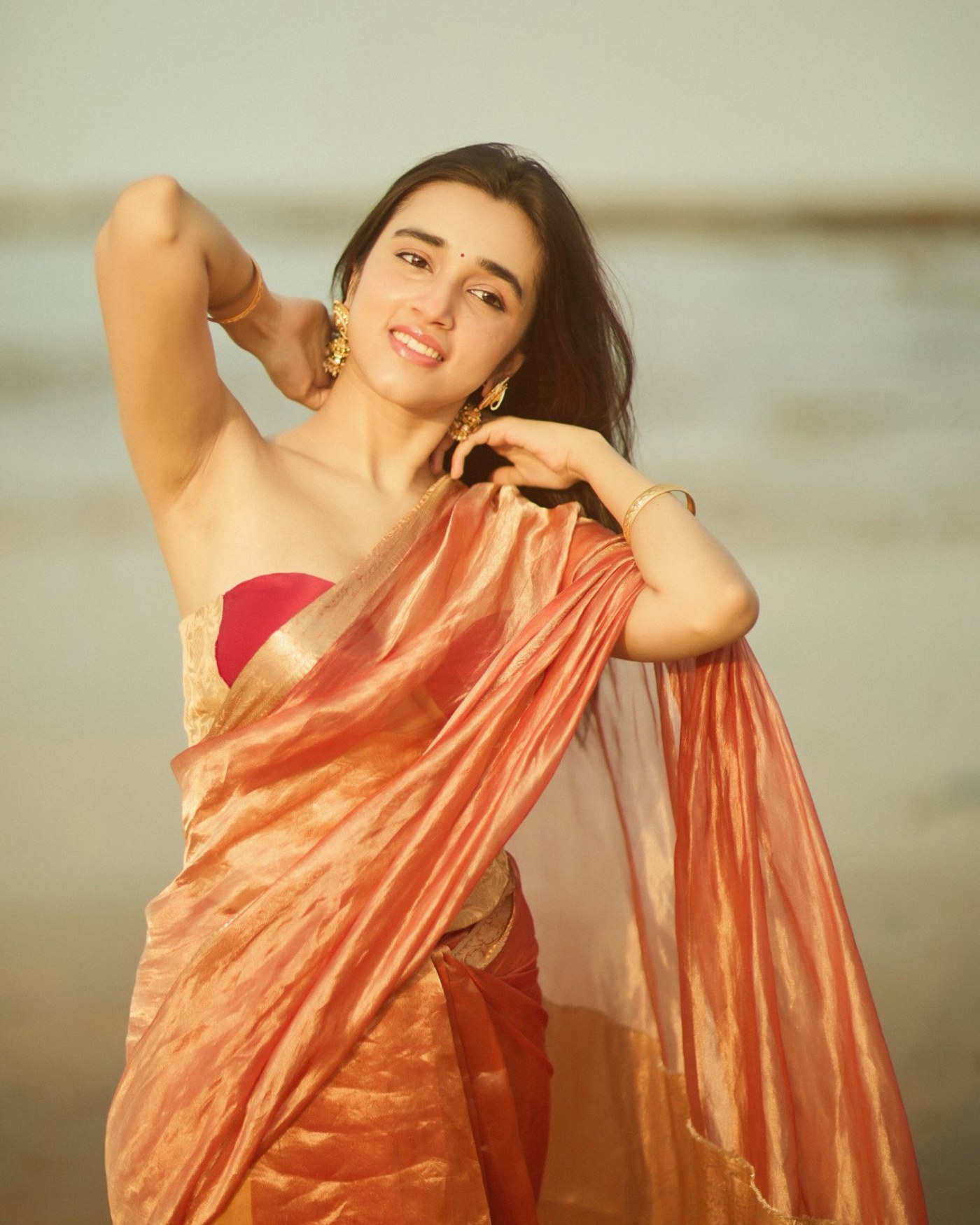 Nuveksha’s Royal Copper Glow: Mastering Glamour on the Shoreline