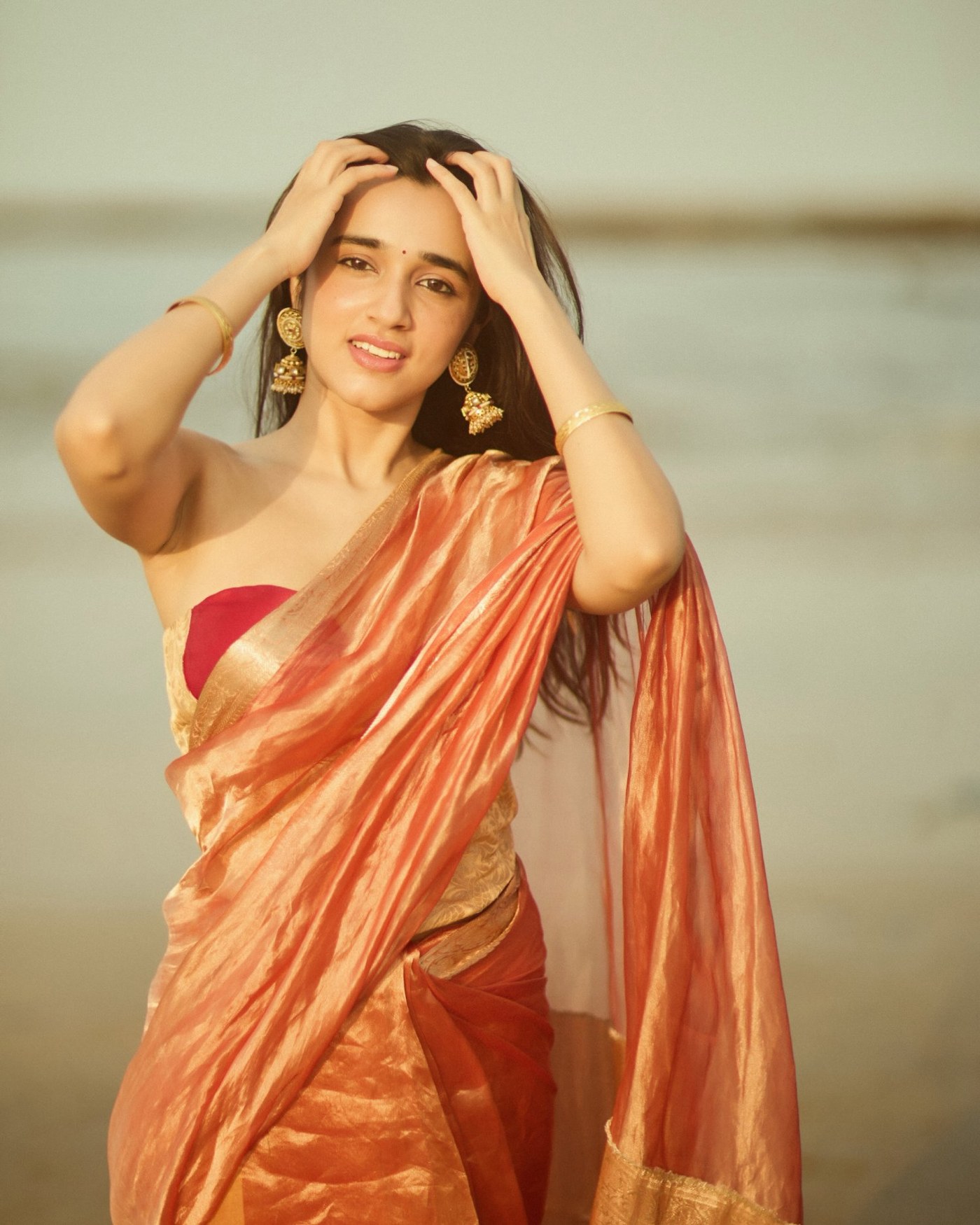 Nuveksha’s Royal Copper Glow: Mastering Glamour on the Shoreline