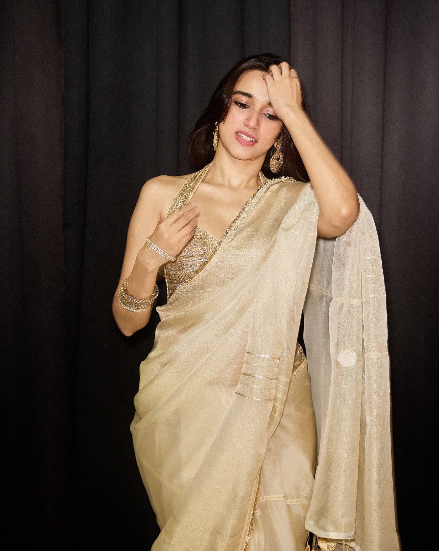 Nuveksha radiates effortless grace in a richly textured golden saree ensemble.