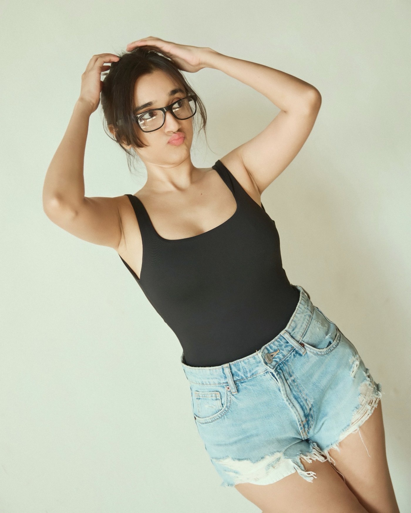 Nuveksha rocks a relaxed, street-style aesthetic in comfortable denim shorts and breezy top layers. - Photos & Updates