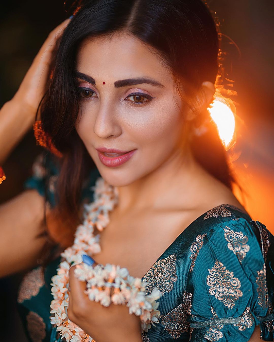 Golden Hour Glow: Parvati Nair's Ethereal Beauty