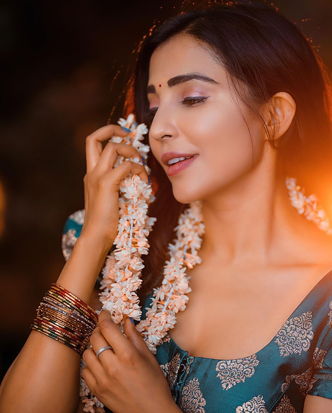 Golden Hour Glow: Parvati Nair's Ethereal Beauty