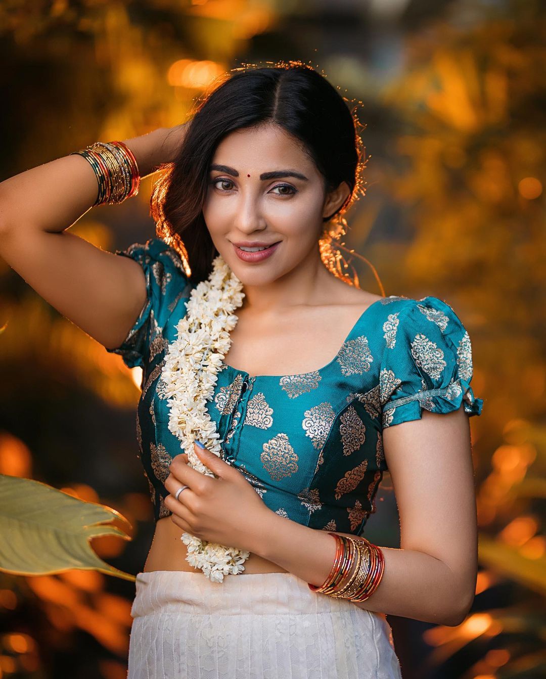 Golden Hour Glow: Parvati Nair's Ethereal Beauty