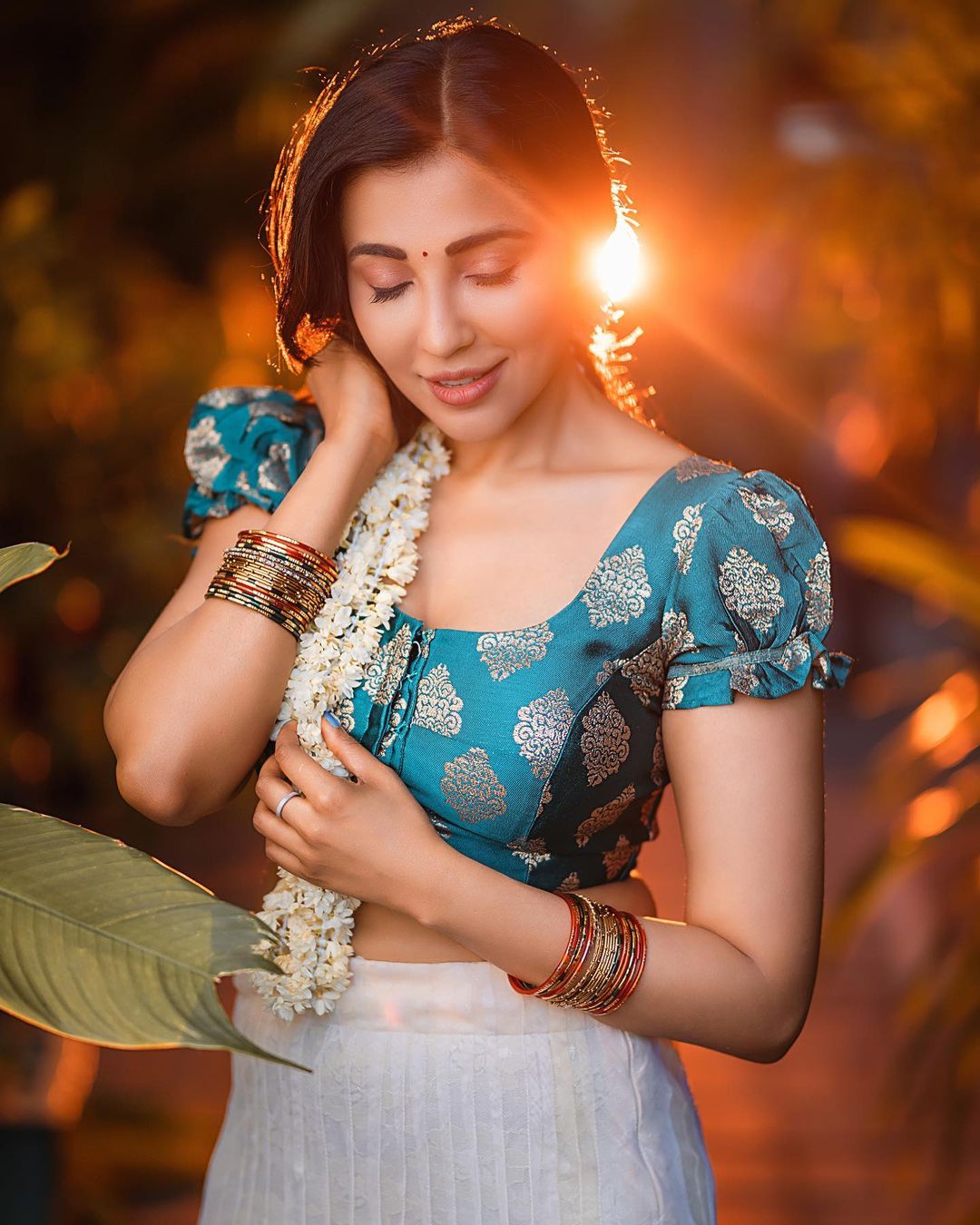 Golden Hour Glow: Parvati Nair's Ethereal Beauty