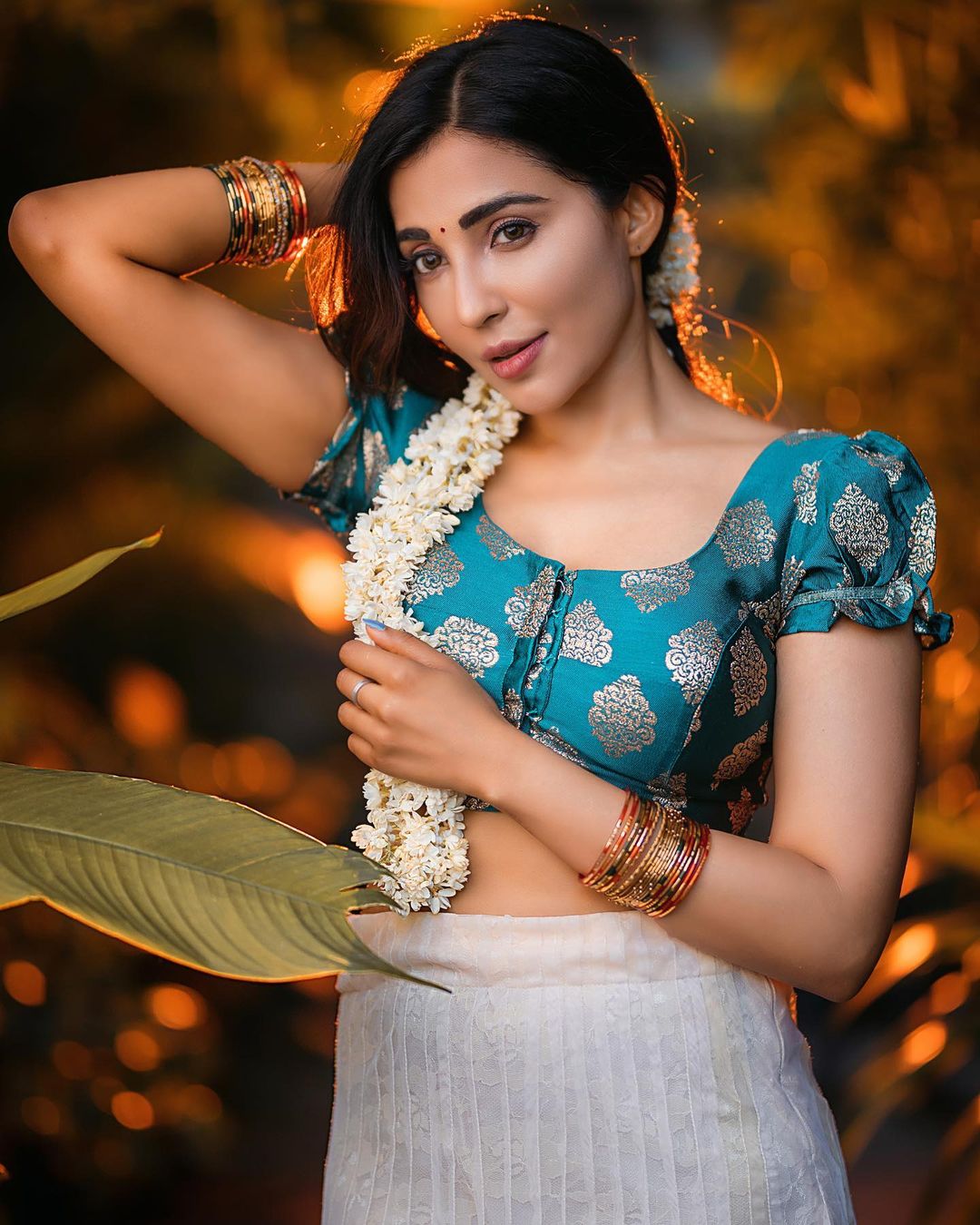 Golden Hour Glow: Parvati Nair's Ethereal Beauty