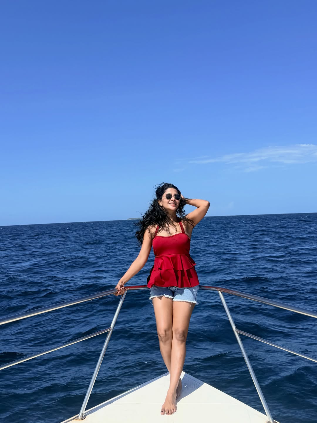 Pavithra Lakshmi's Coastal Charm: Red, Denim, and Deep Blue Vibes