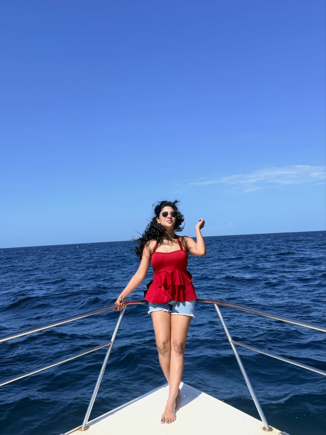 Pavithra Lakshmi's Coastal Charm: Red, Denim, and Deep Blue Vibes