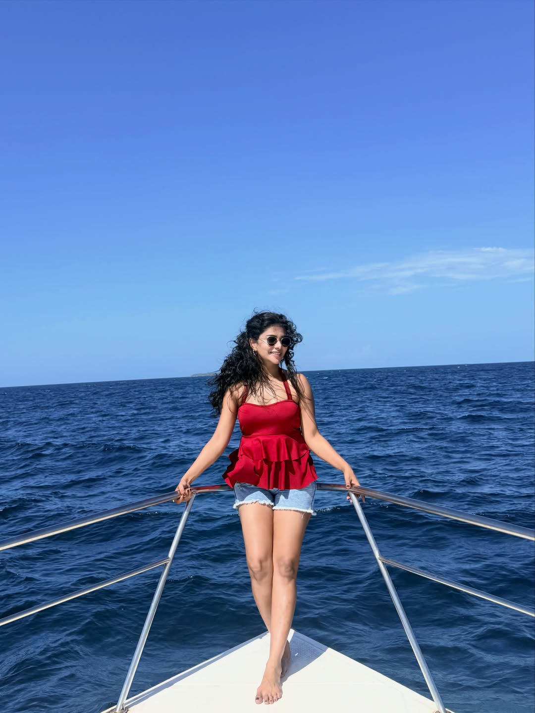 Pavithra Lakshmi's Coastal Charm: Red, Denim, and Deep Blue Vibes