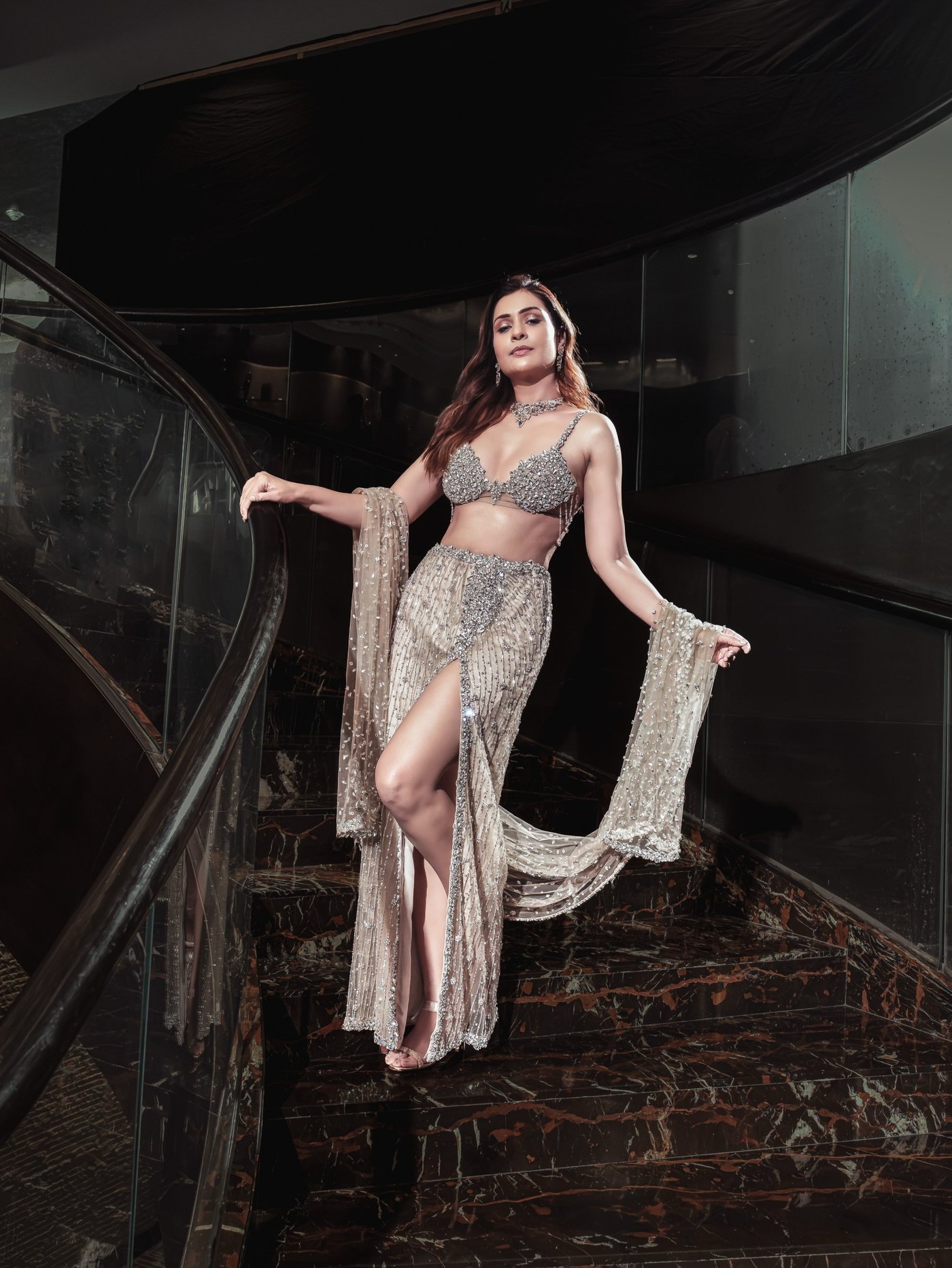 Payal Rajput showcases modern glamour in a dazzling silver two-piece ensemble with statement jewelry. - Photos & Updates