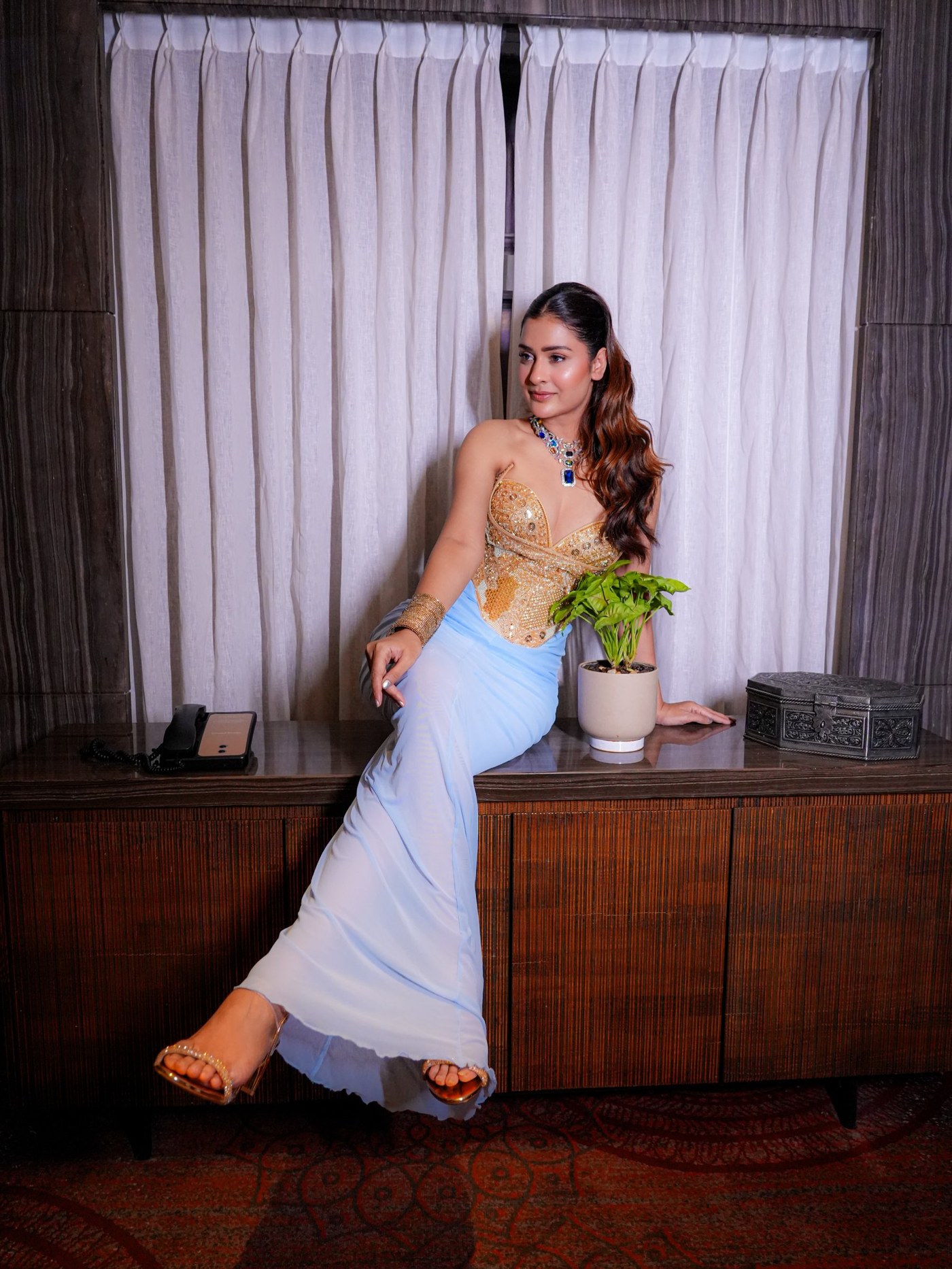 Payal Rajput Masters the Art of Structured Drape in Gold and Blue