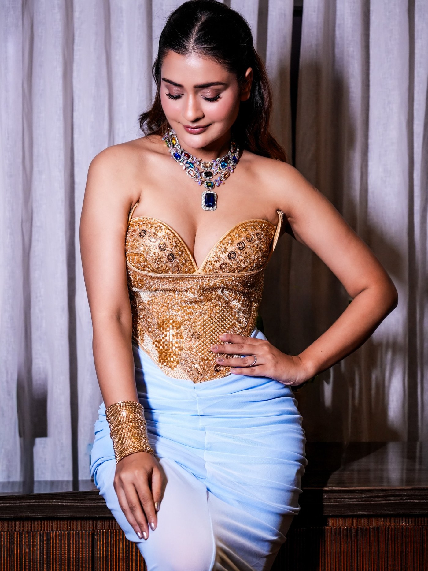 Payal Rajput Masters the Art of Structured Drape in Gold and Blue