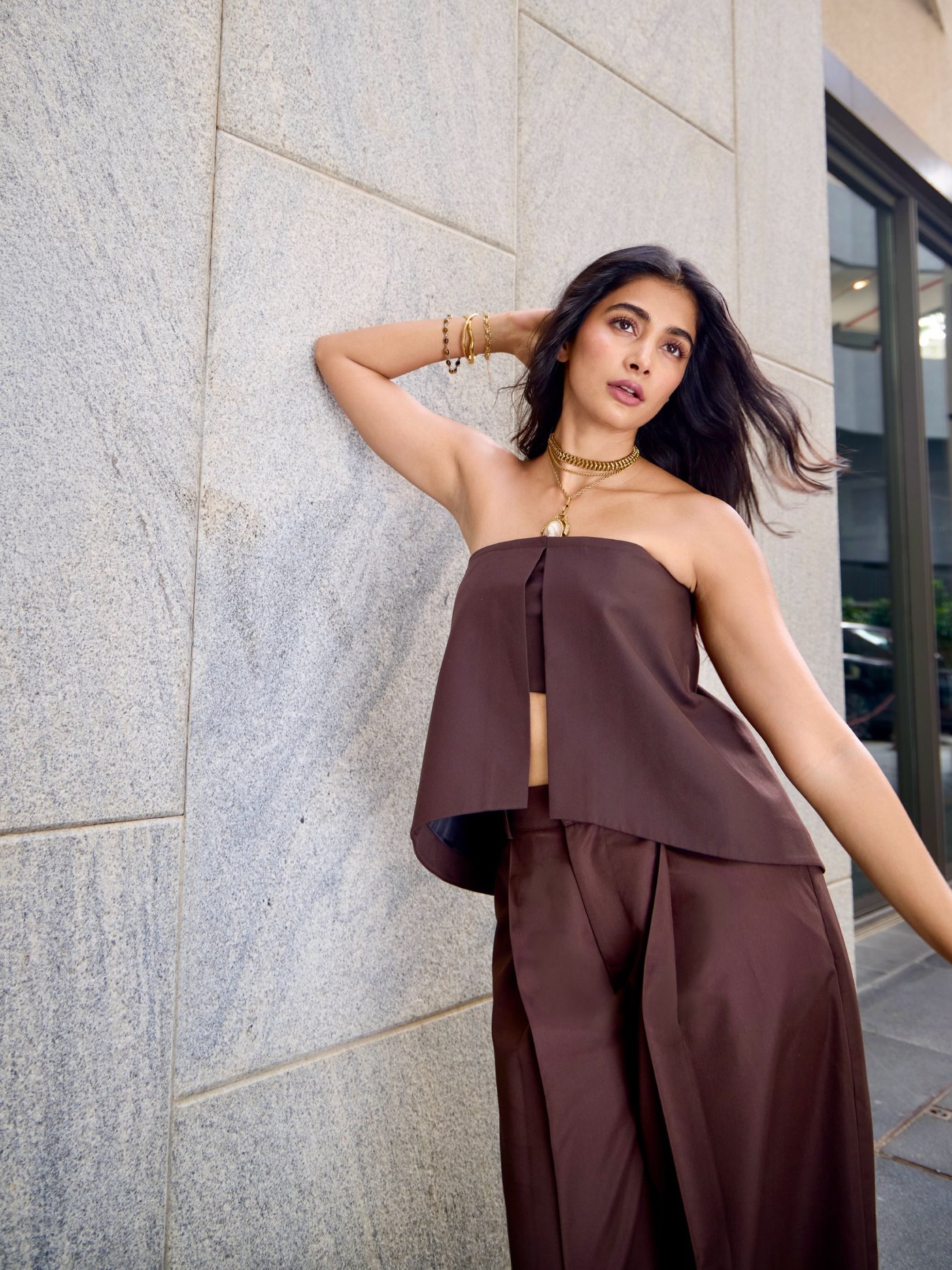 Pooja Hegde showcases a rich, chocolate-toned ensemble embodying modern quiet luxury glamour. - Photos & Updates