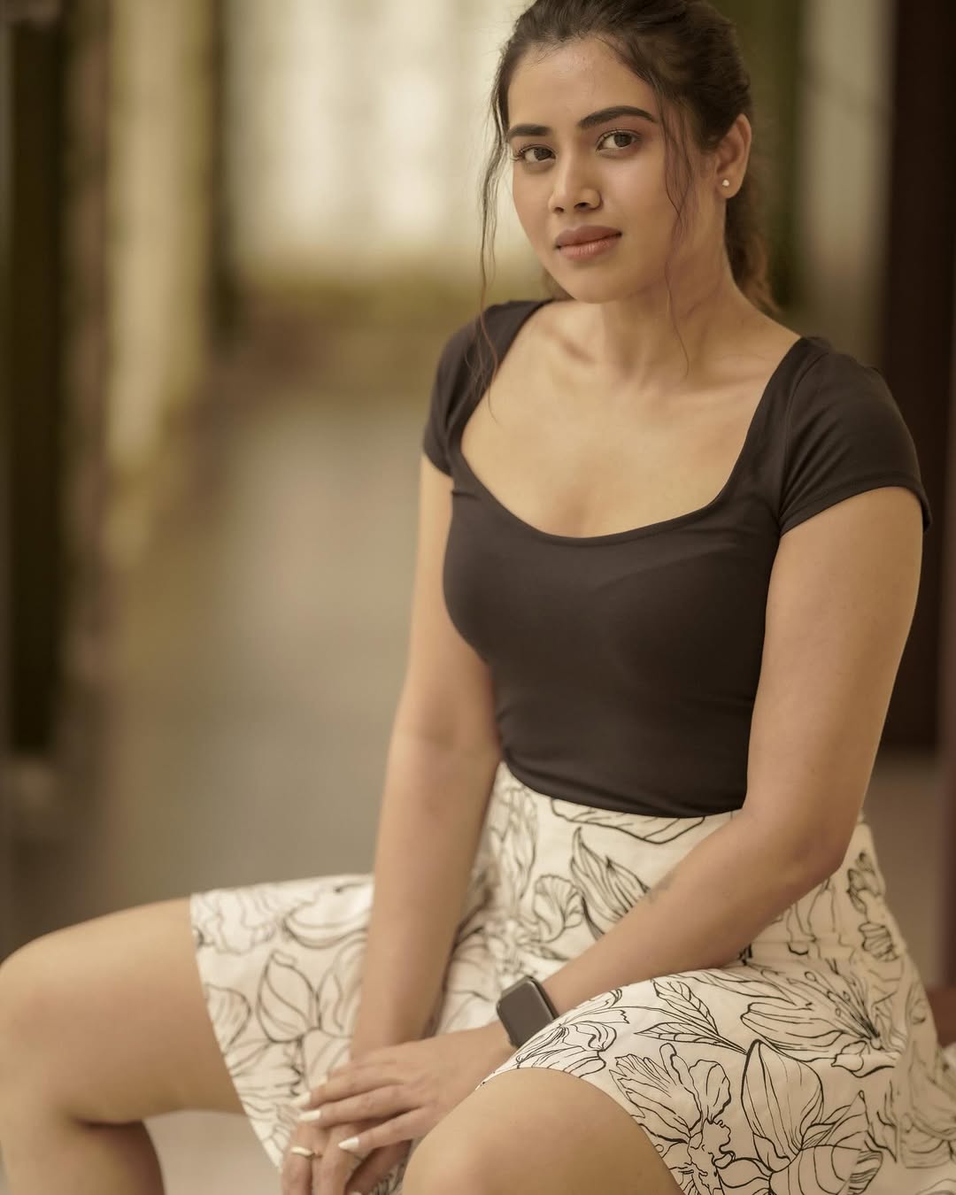 Aarthi Subash is seen posing on a set, showcasing a beautiful festive ensemble.
