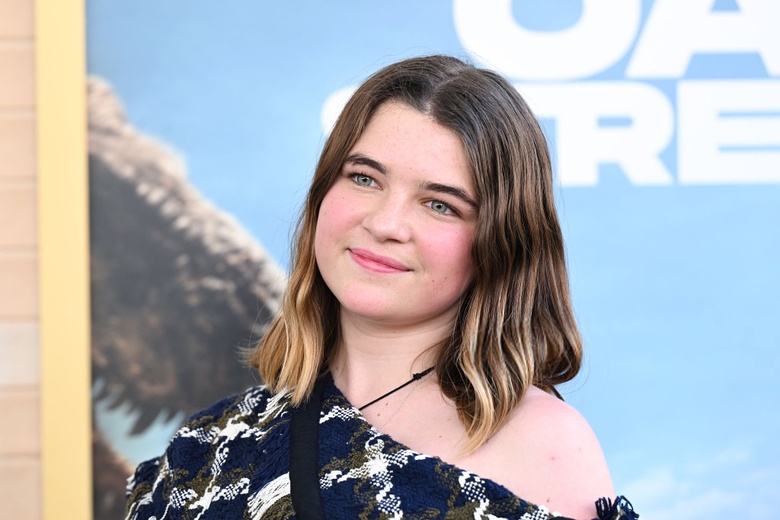 Raegan Revord poses gracefully on a red carpet at the End of Oak Street world premiere in Los Angeles. - Photos & Updates