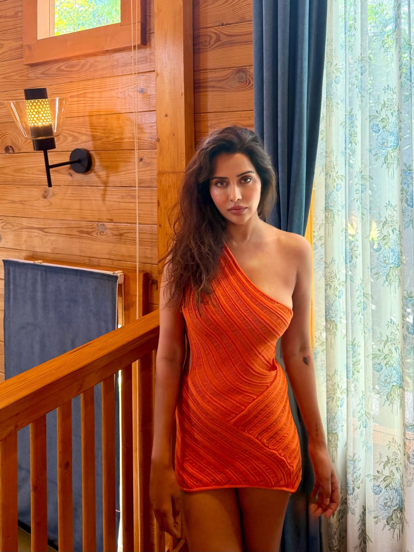 Orange Pop! Raiza Wilson Dazzles in Vivid Mini Dress