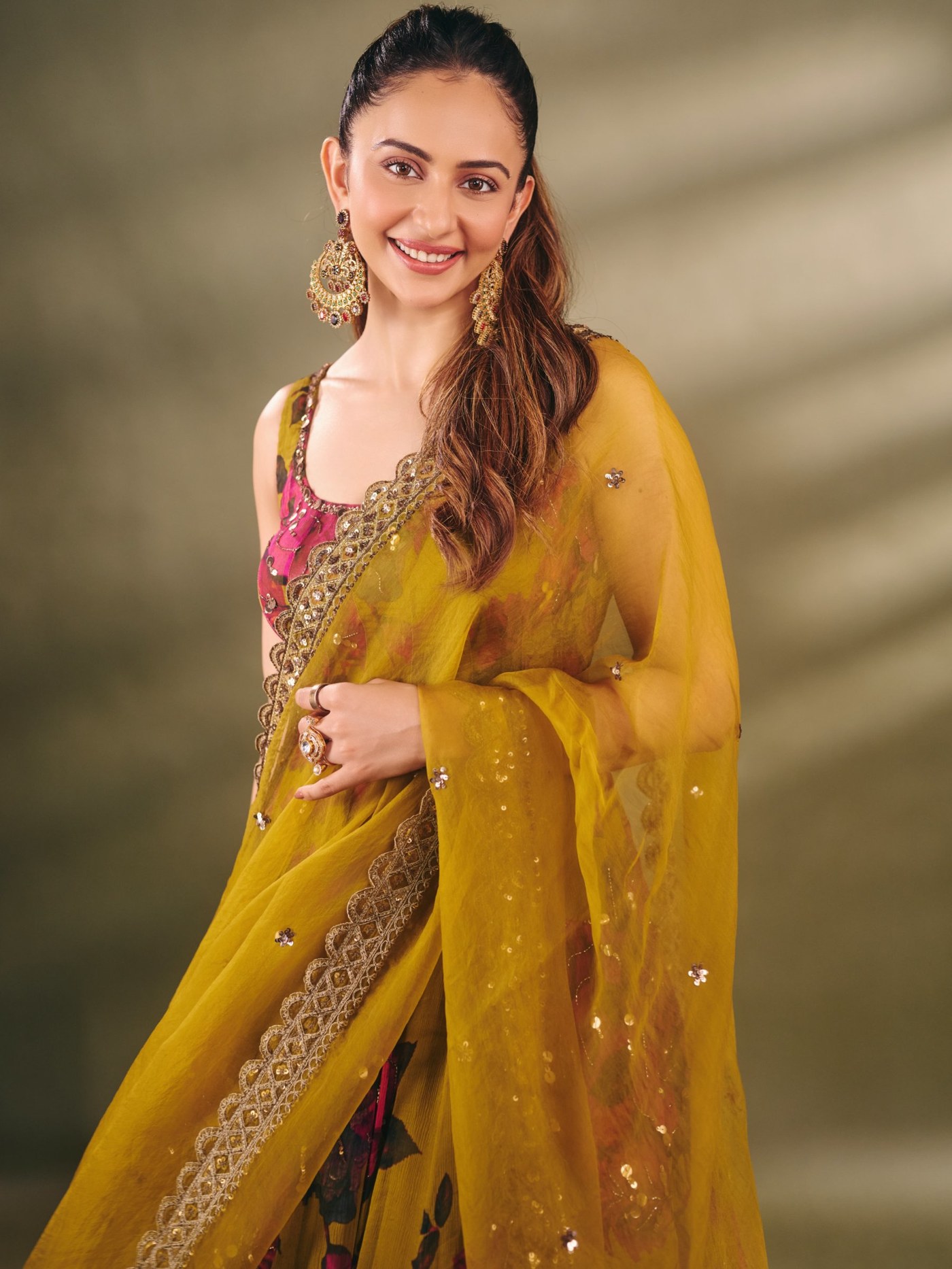 Rakul Preet Singh shines in a rich magenta and mustard traditional lehenga ensemble, showcasing vibrant Indian fashion. - Photos & Updates