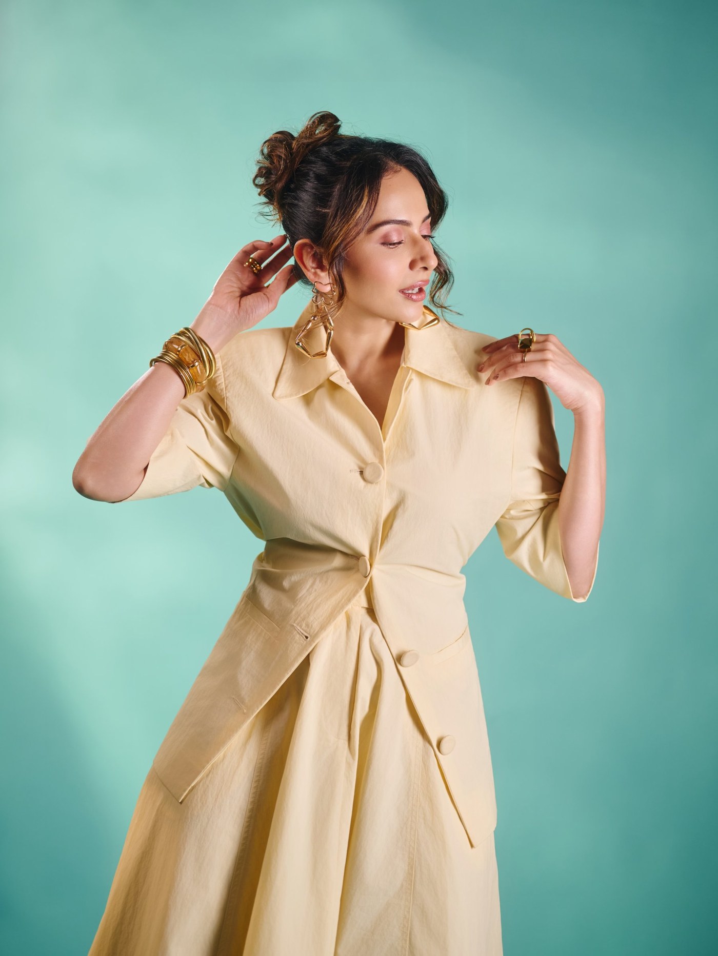 Rakul Preet Singh showcases a cream sculptural coat-dress and gold jewelry. - Photos & Updates