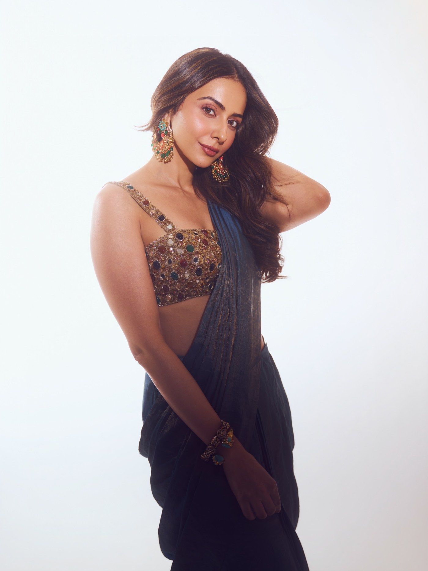 Rakul Preet Singh in a midnight blue sari with an embellished blouse.