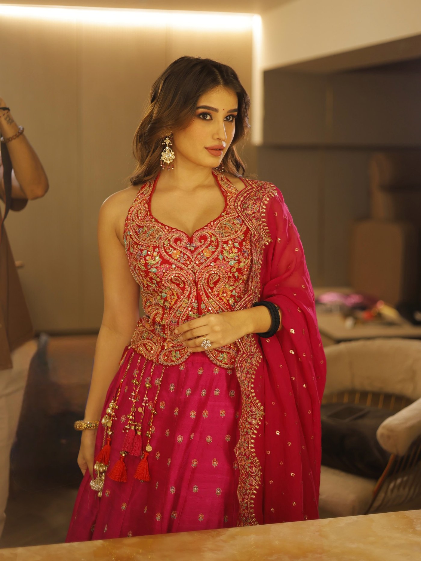 Rasha Thadani showcases embroidered lehenga in fuchsia and deep red tones. - Photos & Updates