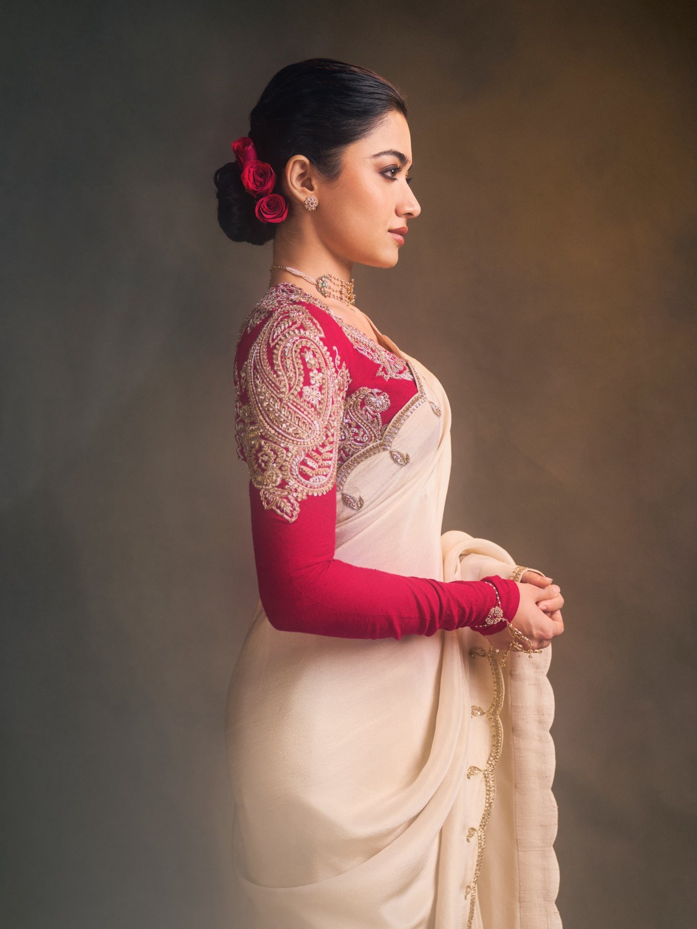 Ivory Drape Meets Ruby Red: Rashmika’s Festive Statement
