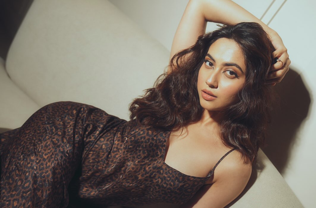 Reem Shaikh showcases a fashion-forward ensemble featuring a sophisticated leopard print pattern at an event.