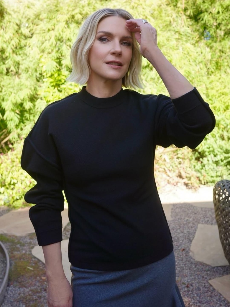 Rhea Seehorn posing at an event, showcasing a vibrant and stylish appearance.