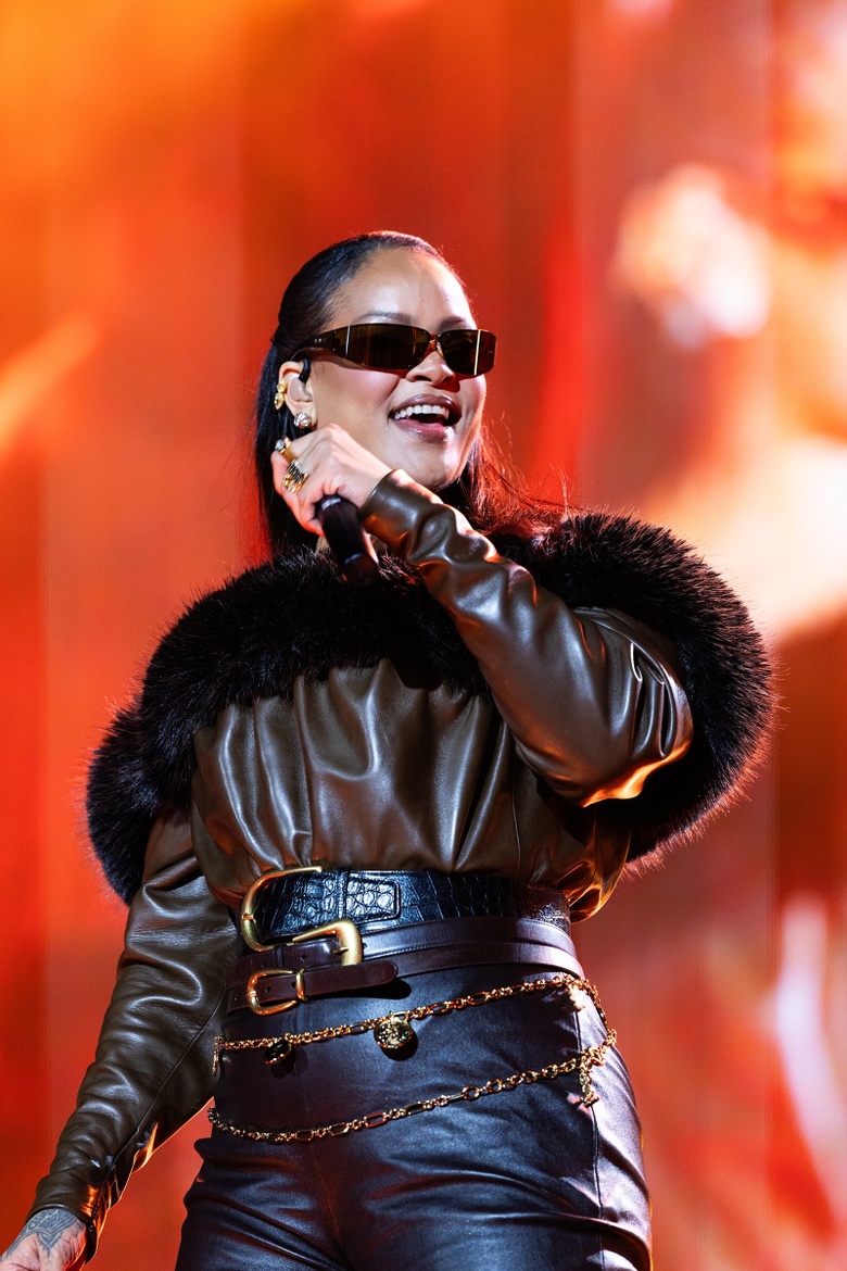 Rihanna embodies global glamour as a Barbadian singer, commanding the spotlight.