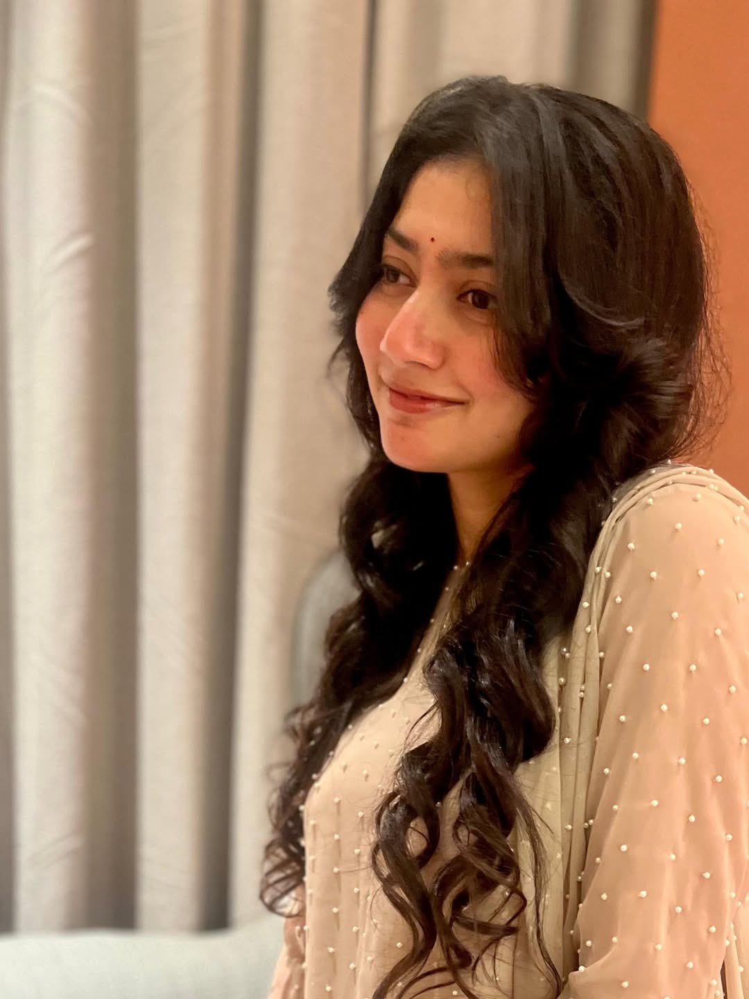 Coral Saree Statement: Sai Pallavi at Temple Event