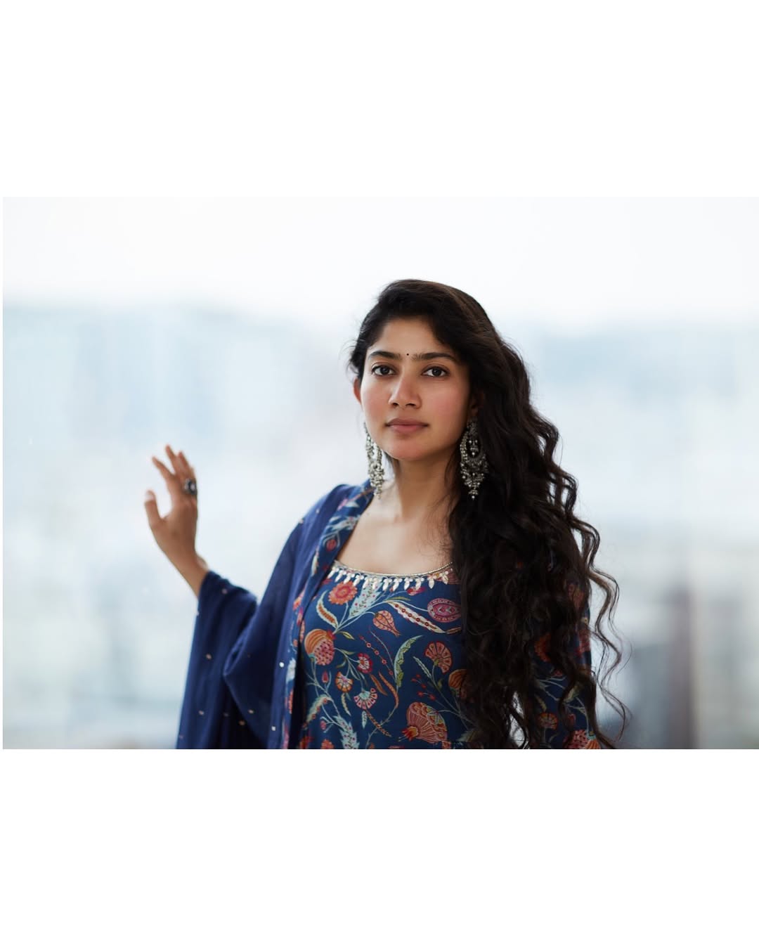Coral Saree Statement: Sai Pallavi at Temple Event