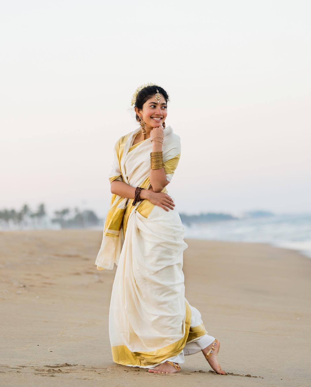 Coral Saree Statement: Sai Pallavi at Temple Event