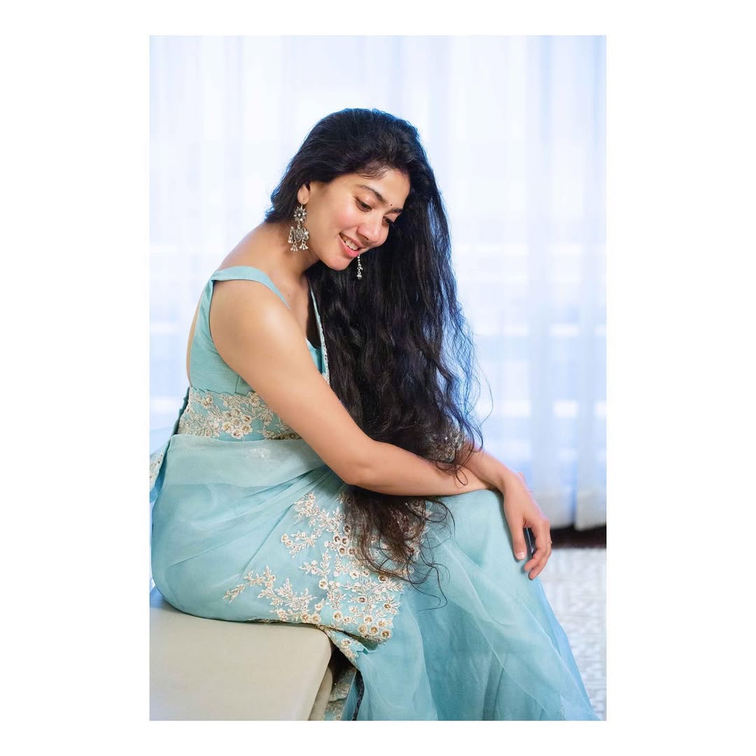 Coral Saree Statement: Sai Pallavi at Temple Event