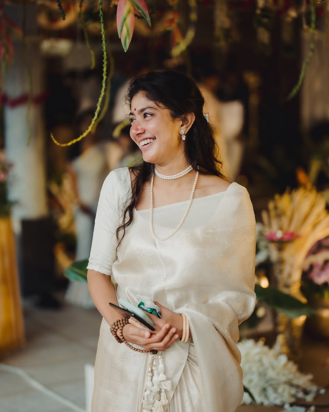 Coral Saree Statement: Sai Pallavi at Temple Event