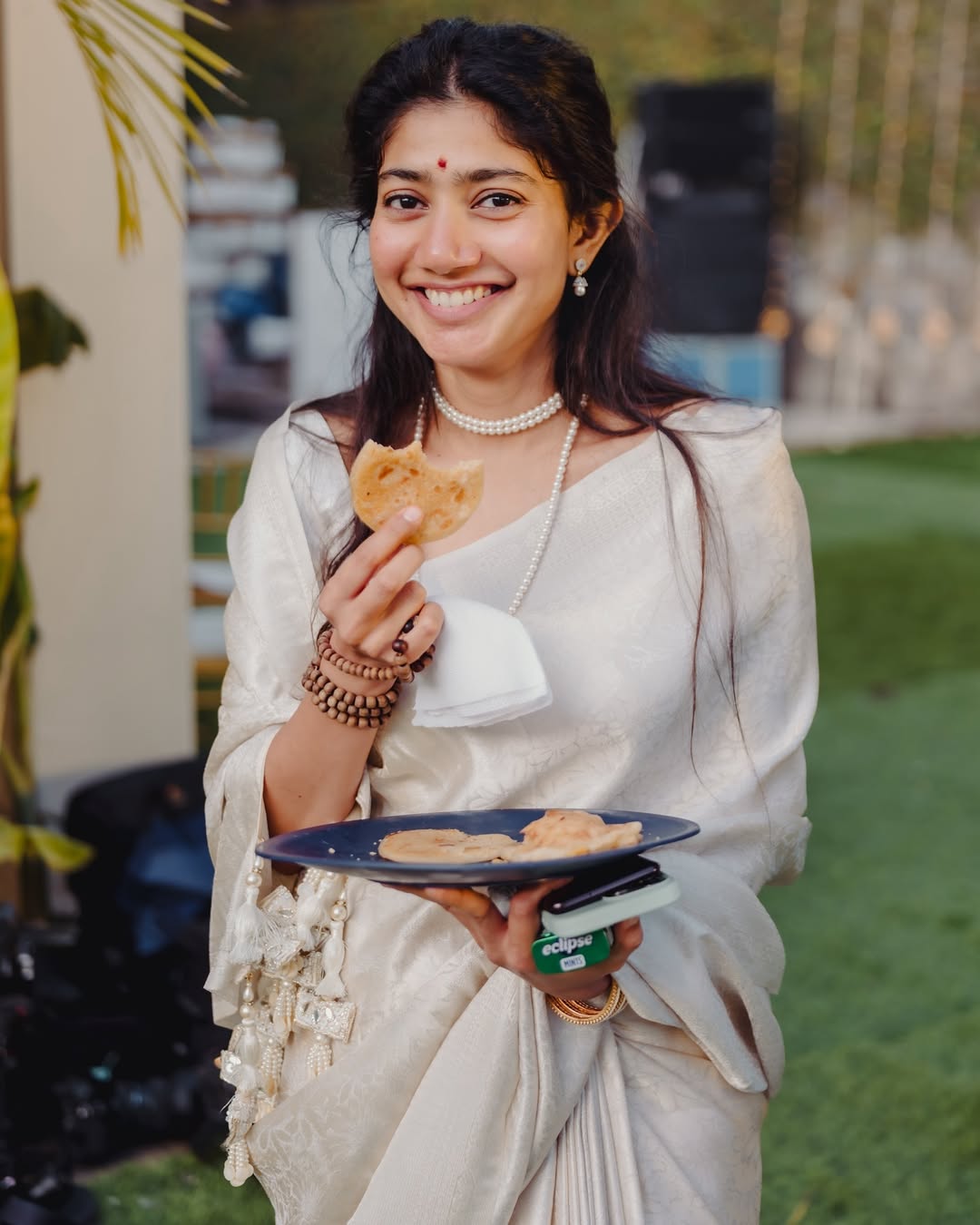 Coral Saree Statement: Sai Pallavi at Temple Event