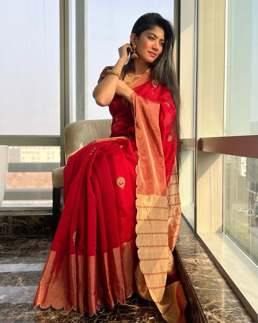 Coral Saree Statement: Sai Pallavi at Temple Event