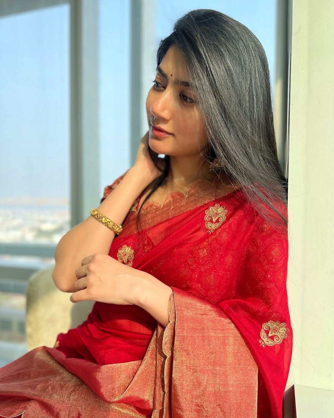 Coral Saree Statement: Sai Pallavi at Temple Event