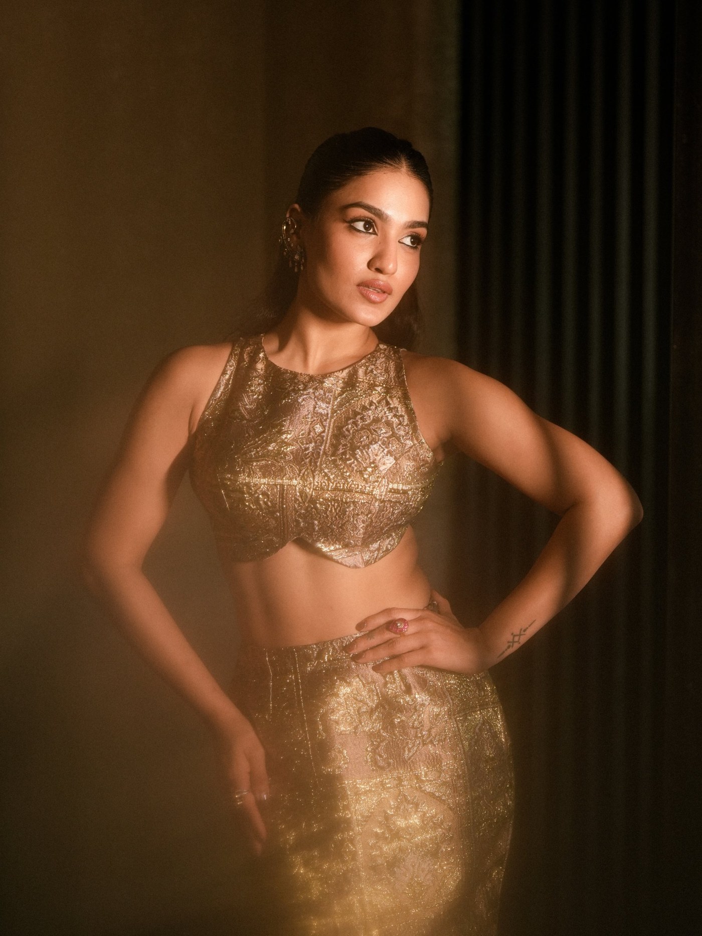 Saniya Iyappan showcases a stunning gold brocade ensemble, merging heritage textiles with sharp, modern tailoring. - Photos & Updates