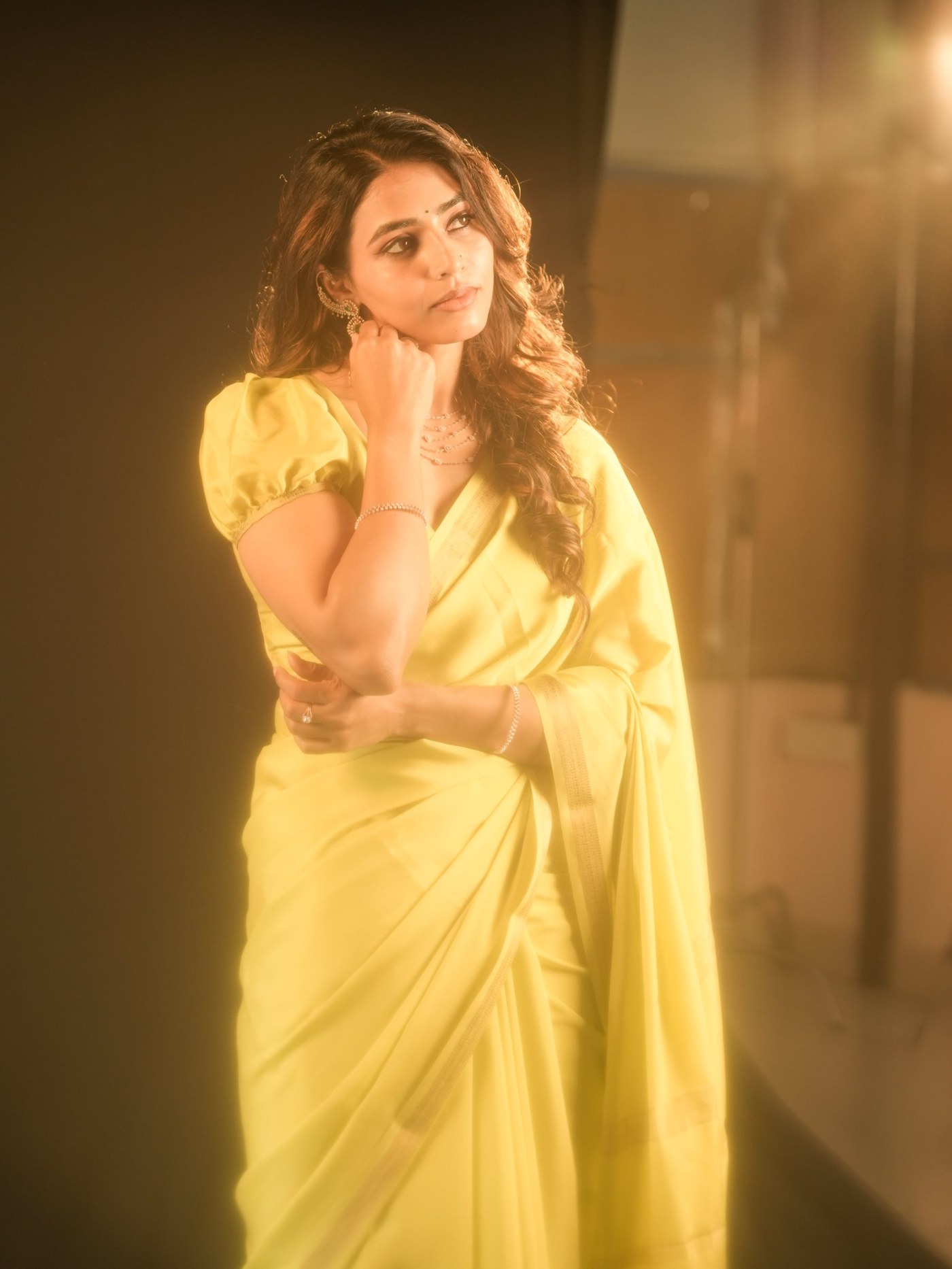 Sapthami Gowda is captured in a vibrant yellow saree, showcasing a blend of tradition and contemporary style. - Photos & Updates