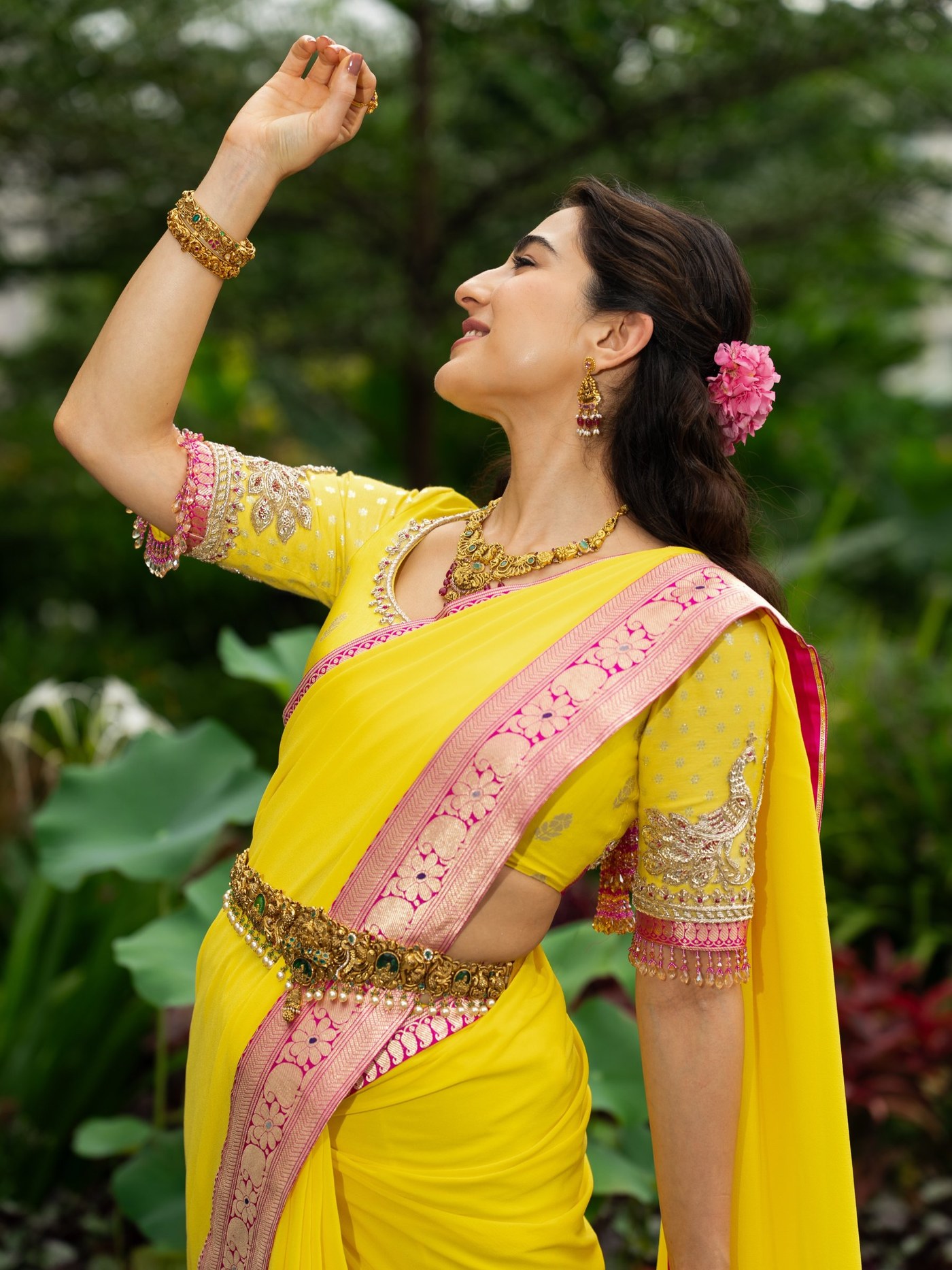 Sara Ali Khan in a yellow sari accented with pink detailing. - Photos & Updates