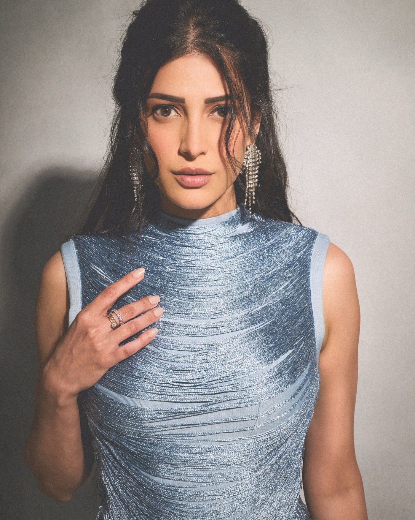 Shruti Haasan showcases an ethereal pastel blue outfit, embodying contemporary glamour and refined style.