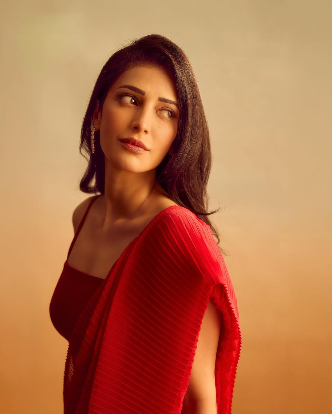 Shruti Haasan's Red Radiance: A Photo Gallery