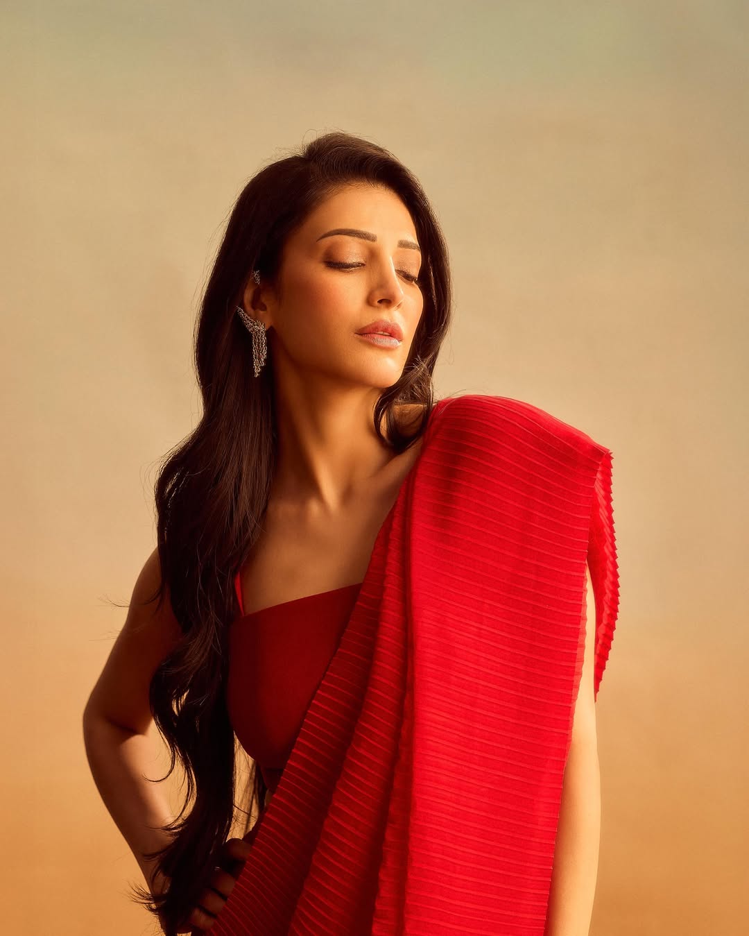 Shruti Haasan's Red Radiance: A Photo Gallery