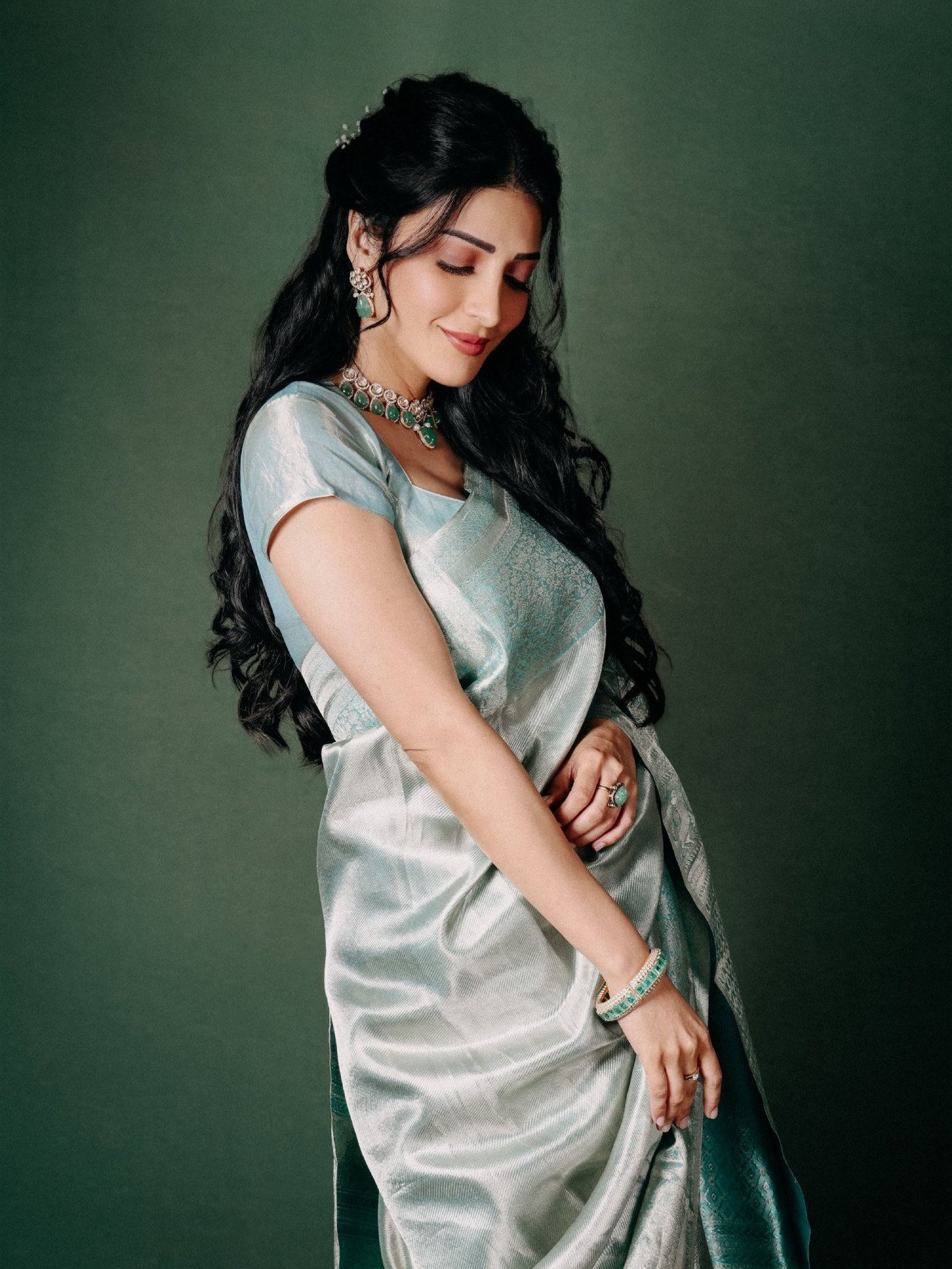 Shruti Haasan showcases a beautiful ensemble in an elegant pastel silk saree at a recent event.