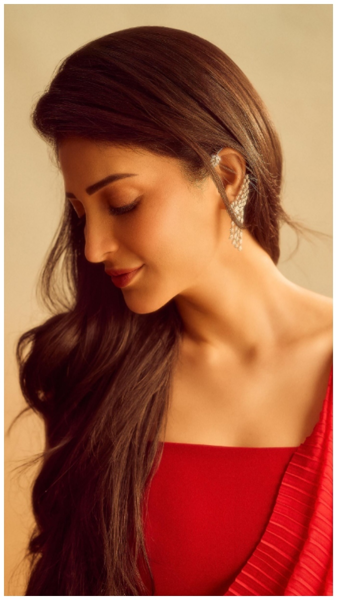 Shruti Haasan in a diptych featuring a vibrant red outfit with intricate textured detailing and a plain warm background.