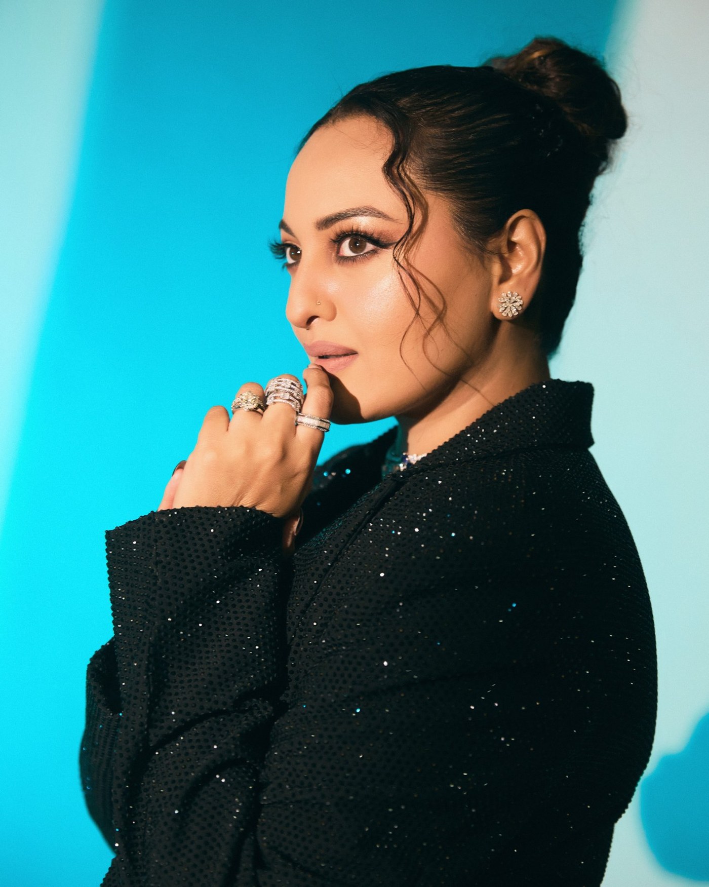 Sonakshi Sinha showcases a bold, contemporary fashion look in striking shades of black at a glamorous event.