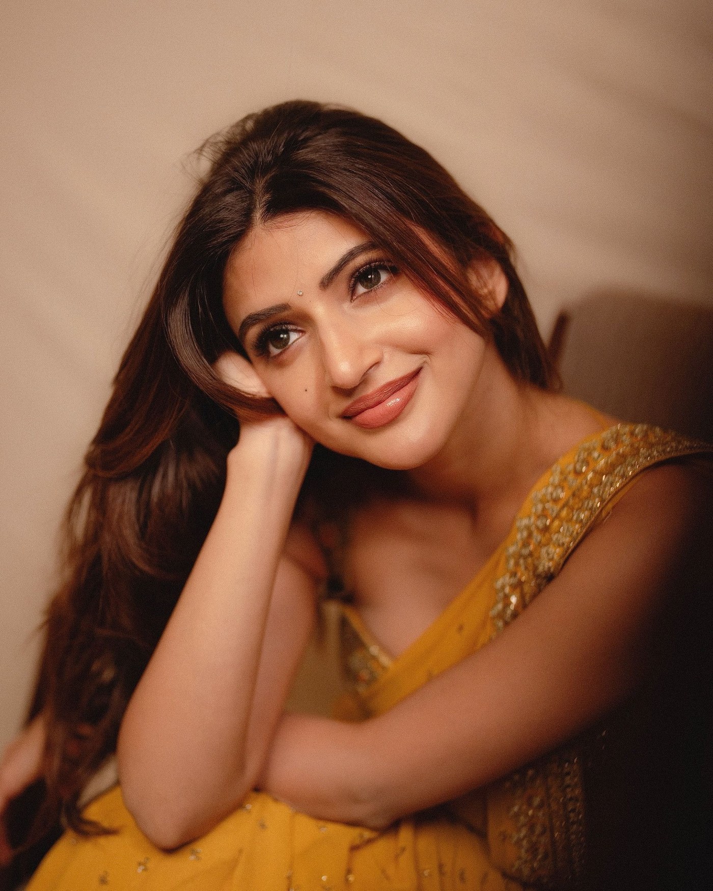 Sreeleela in a marigold-yellow sari with intricate embellishments. - Photos & Updates