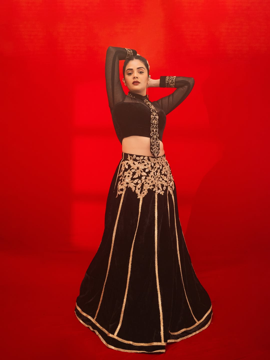Sreemukhi's Regal Red & Gold Ensemble Captures Attention